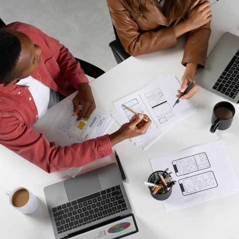 top-view-people-working-with-laptops_23-2149762477