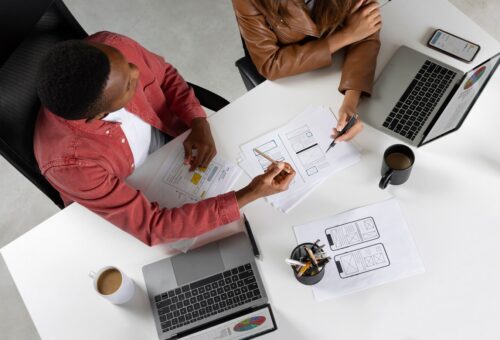top-view-people-working-with-laptops_23-2149762477