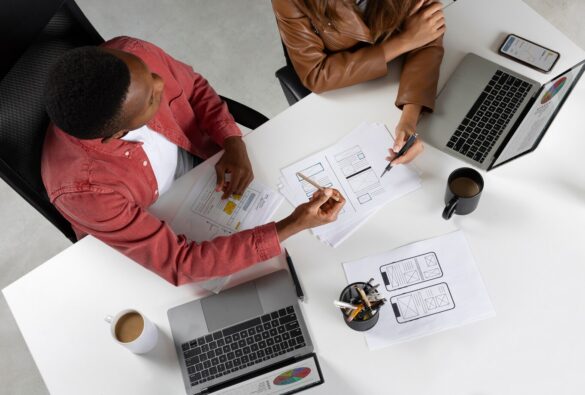 top-view-people-working-with-laptops_23-2149762477